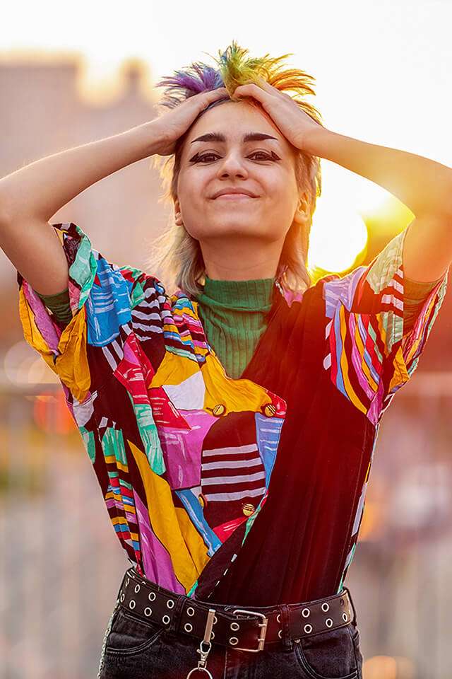 woman with brightly colored hair and clothing