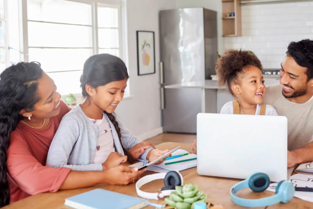 Family at kitchen table learns about Hispanic Heritage Month